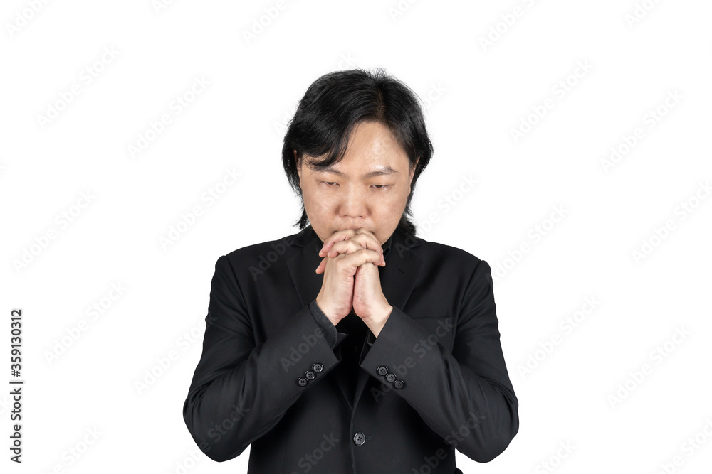 Isolated Asian business man in black suit hand together and prays for something on white background. Clipping Path. Isolated Asian business man in black suit hand together and prays for something on white background. Clipping Path.