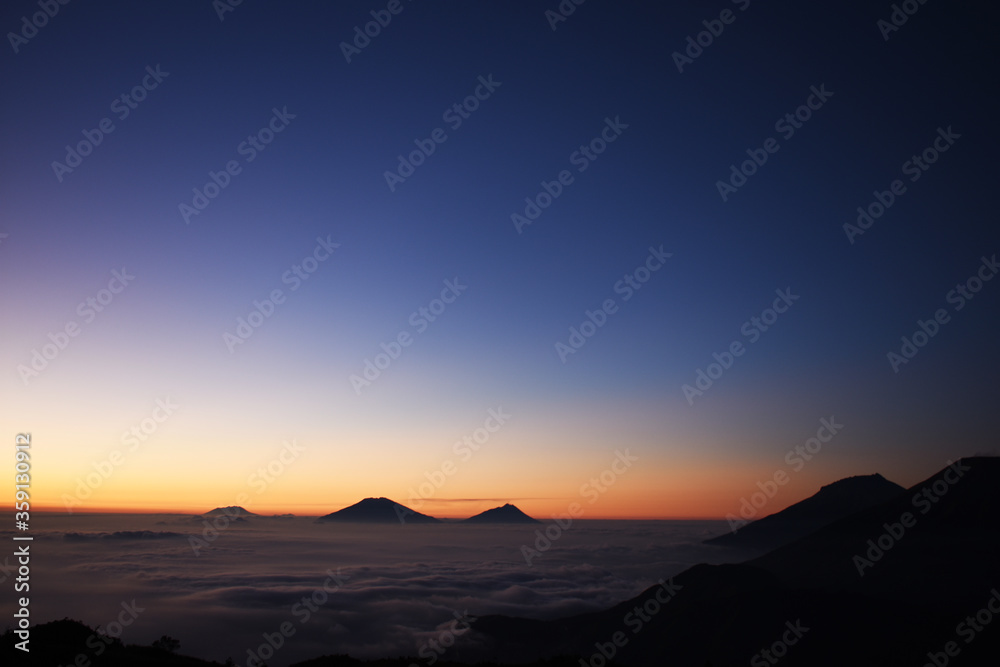Golden sunrise at Prau mountains. Mt. Prau, Central Java, Indonesia Golden sunrise at Prau mountains. Mt. Prau, Central Java, Indonesia