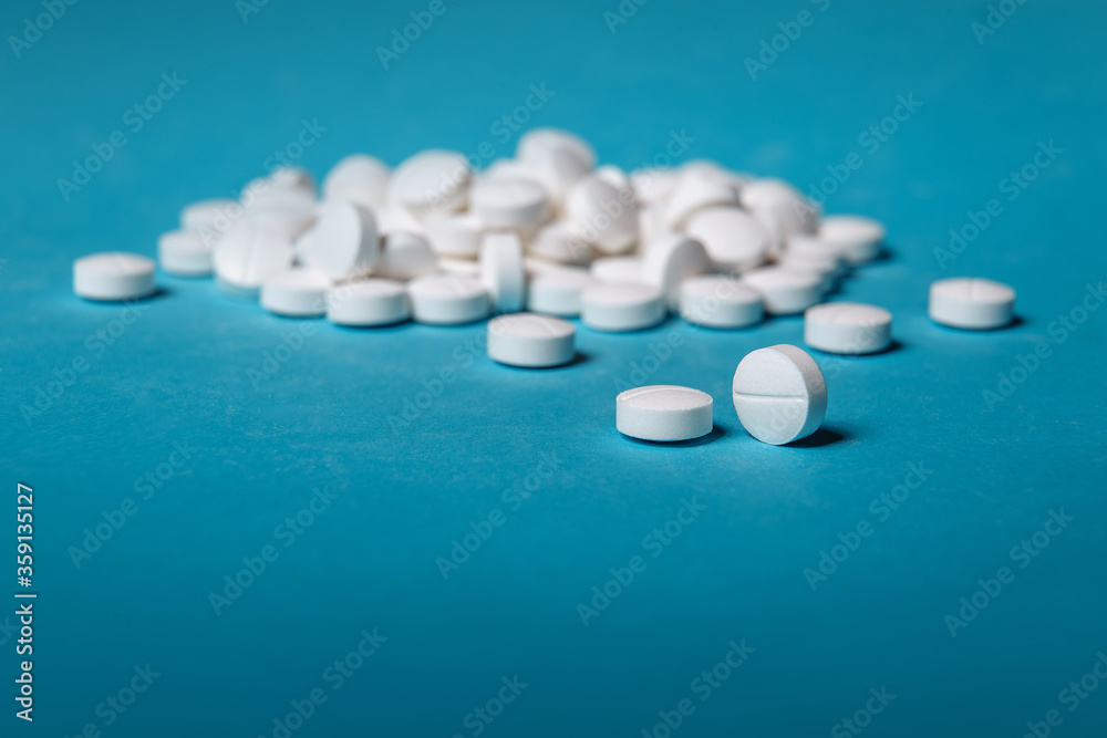Vitamin C on a blue background. Vitamin C, Vitamin E, Vitamin D3. Various treatments mixed. Variety of pills and medication. Medical concept. Vitamin C on a blue background. Vitamin C, Vitamin E, Vitamin D3. Various treatments mixed. Variety of pills and medication. Medical concept.