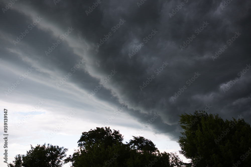 Obraz premium Stormy dark clouds before the storm. Textured gray and blue clouds in the sky