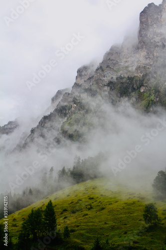 Fog at swiss mountain cliff