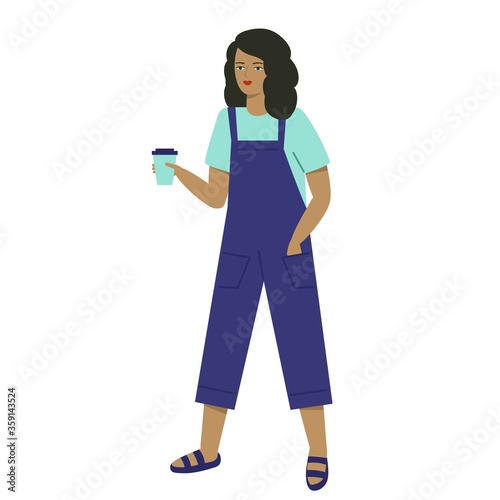 A young woman in overalls holds a glass. The girl carries coffee in her hand.