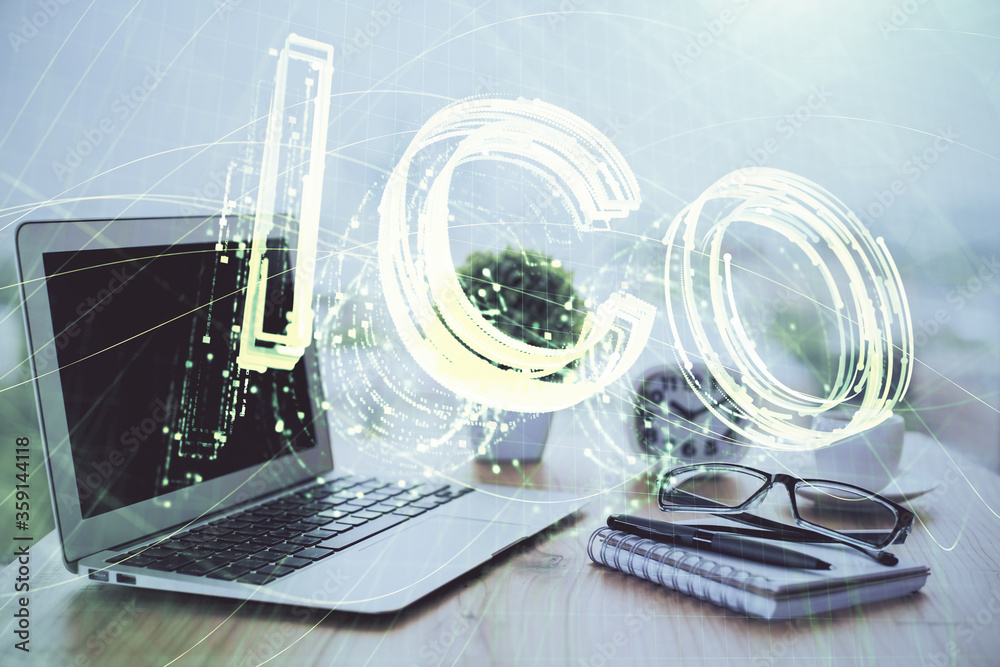 Multi exposure of blockchain and crypto economy theme hologram and table with computer background. Concept of bitcoin cryptocurrency. Multi exposure of blockchain and crypto economy theme hologram and table with computer background. Concept of bitcoin cryptocurrency.
