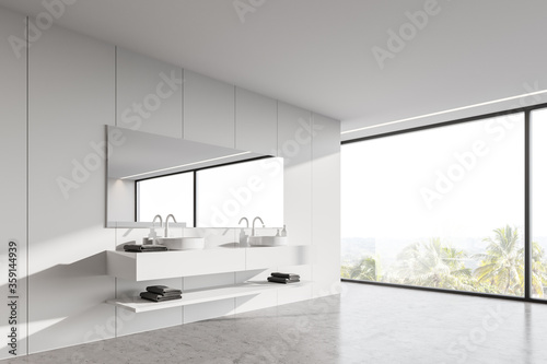 Panoramic white bathroom corner with double sink © ImageFlow