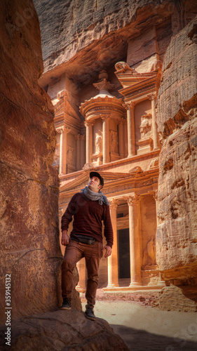 Man in Petra exploring the rocks in front of the Treasury
