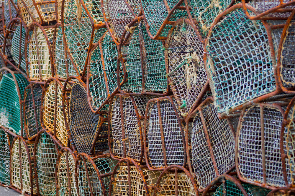 Puerto de Vega, Asturias, Spain. Closeup of row of octopus traps in the harbour.