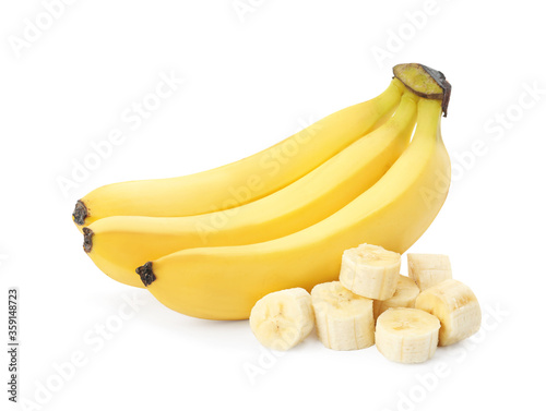 Delicious ripe bananas and pieces isolated on white