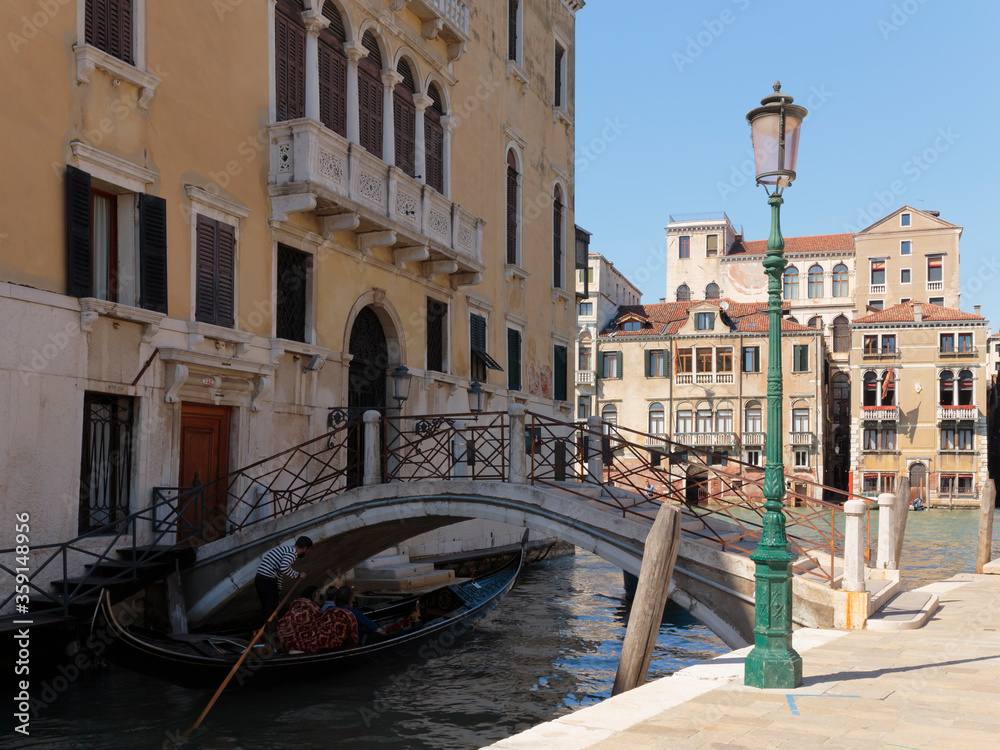 A gondola passing under a bridge on the Rio de San Vio Canal leading into the Grand Canal, Venice, Italy