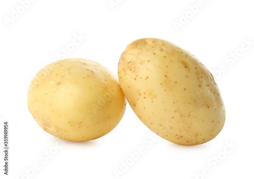 Fresh raw organic potatoes on white background