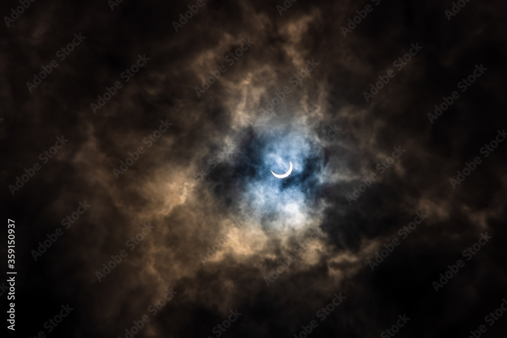 Surreal Dramatic Solar Eclipse Covered By Clouds. Natural Phenomenon. Surreal Dramatic Solar Eclipse Covered By Clouds. Natural Phenomenon.