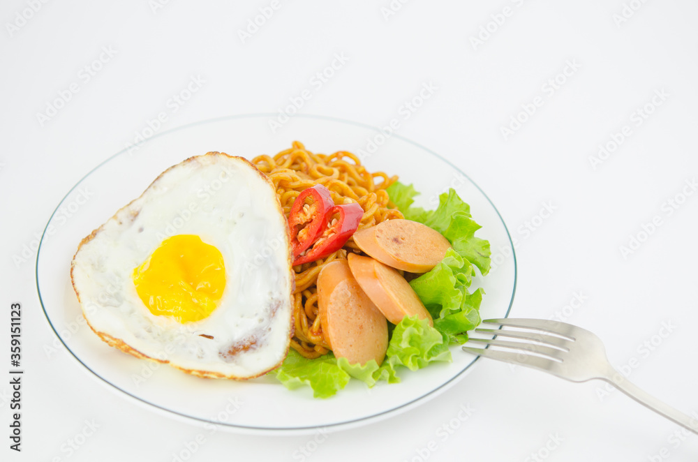 stir-fried instant noodles with omelet and sausage and lettuce stir-fried instant noodles with omelet and sausage and lettuce
