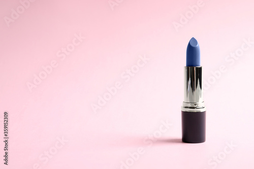 Bright lipstick on pink background. Space for text