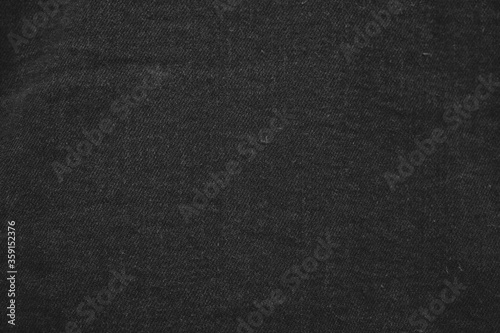 Close up of black jeans jacket fabric.