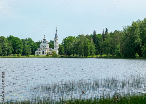 summer landscape with Lake Stameriena and Stameriena Orthodox Church in the background, Latvia photo