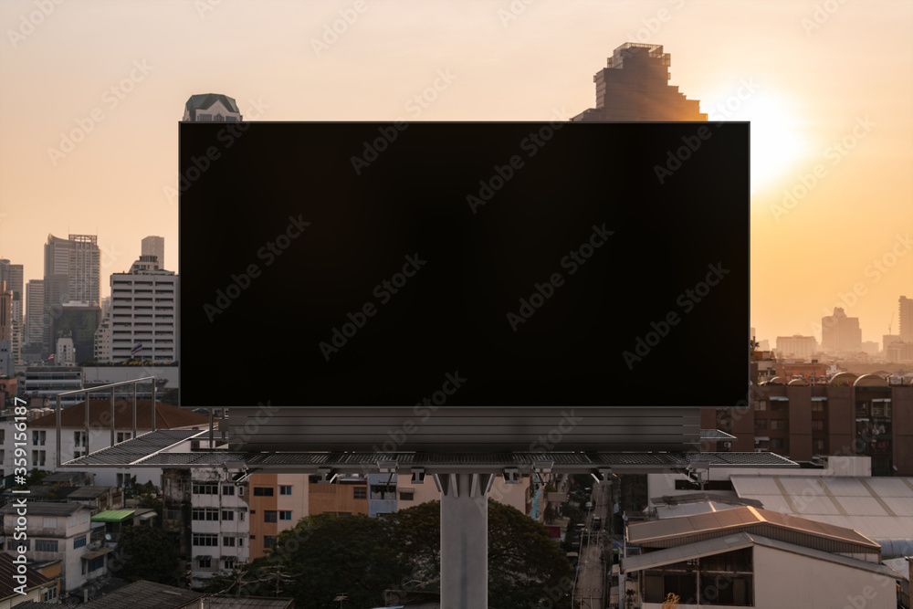 Obraz premium Blank black road billboard with Bangkok cityscape background at sunset. Street advertising poster, mock up, 3D rendering. Front view. The concept of marketing communication to promote or sell idea.