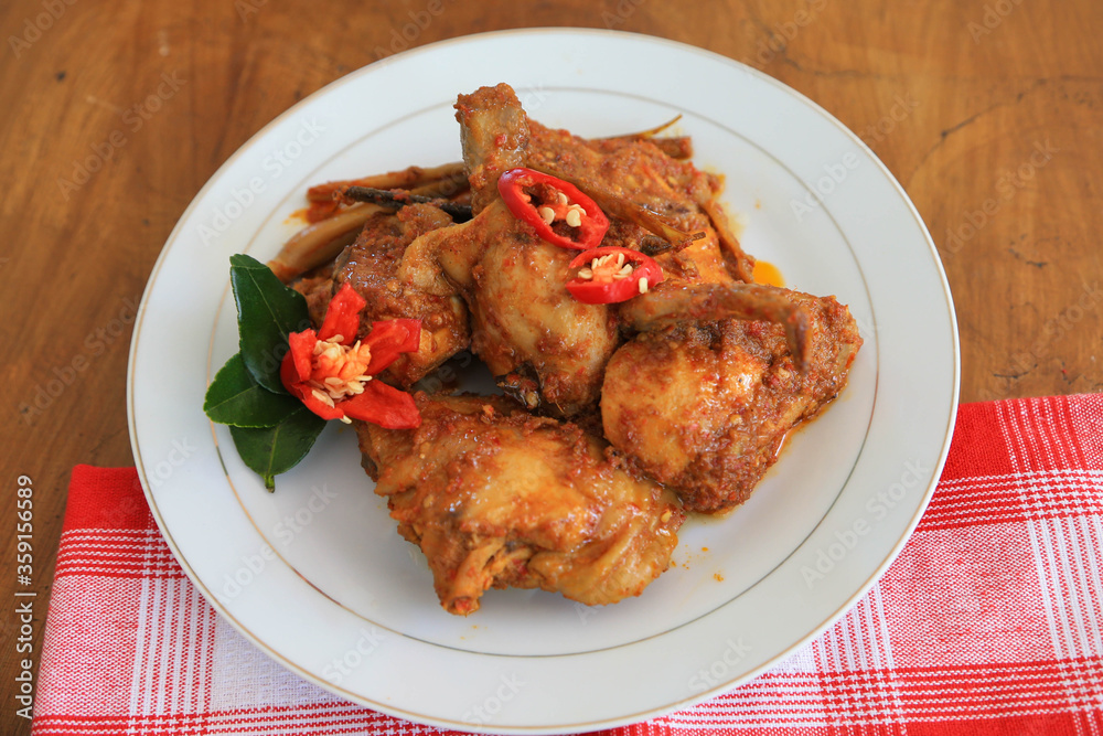 Photos of chicken food cooked spicy and served on a plate Photos of chicken food cooked spicy and served on a plate