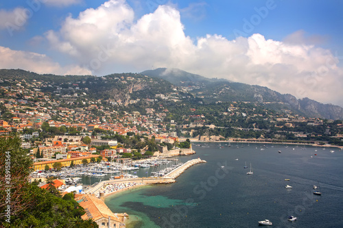 Beautiful view of the French riverira town of Villefranche sur Mer  on the coastline of the mediteranean sea  with a marina  tourist resort  France.