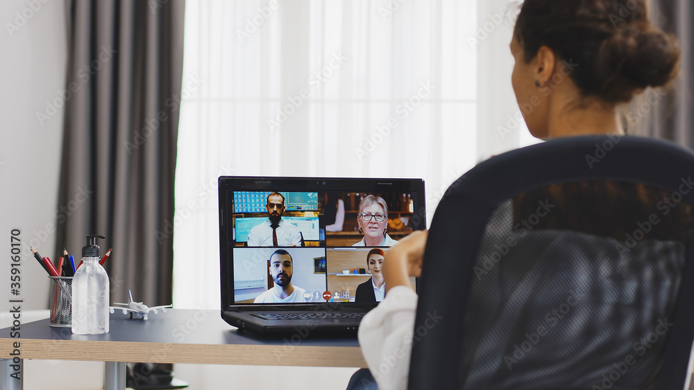 Business woman saying her opinion on a video call with coworkers. Business woman saying her opinion on a video call with coworkers.