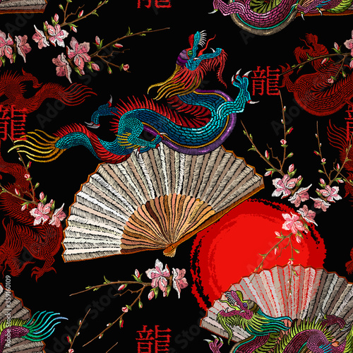 Asian dragons, rising sun, japan fan and sakura flowers. Ethnic horizontal seamless pattern. Oriental art. Fashion japanese and chinese style. Template for clothes