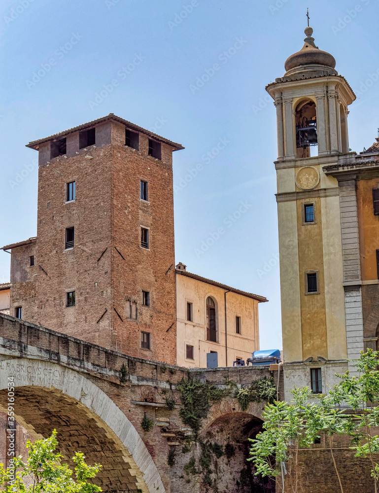 Rome Italy, view from the river to Tiber island tower and church of San Bartolomeo