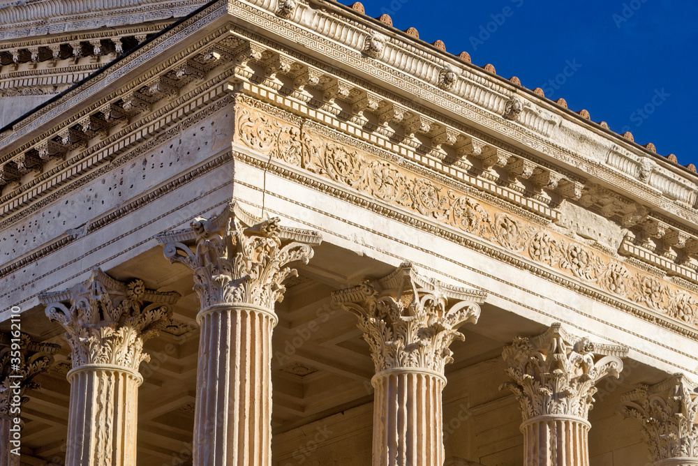 Court house, imposing neoclassical monument with a colonnade in Nimes, France Court house, imposing neoclassical monument with a colonnade in Nimes, France