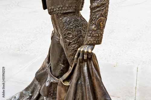 bronze sculpture of Nimeno II a bullfighter in front of the Arena in Nimes, France photo