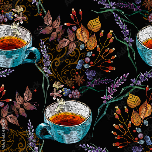 Embroidery cup of tea, lavender flowers and autumn leaves. Fall garden template of clothes, tapestry, t-shirt design. Seamless pattern