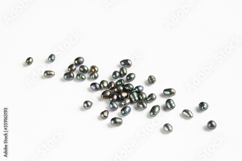 Group of black river pearl beads isolated on white background