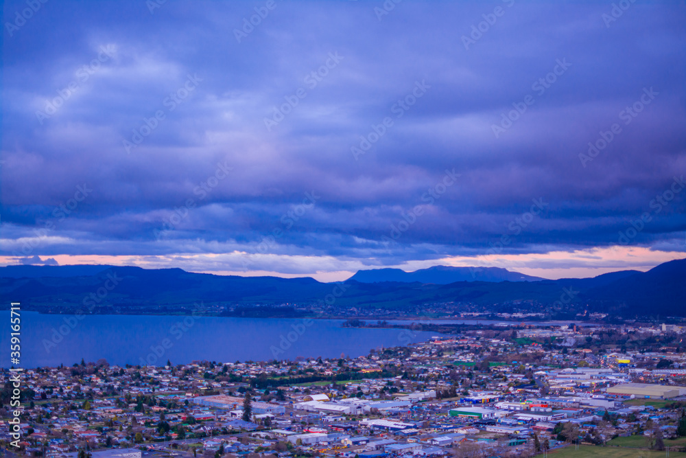 Aerial view of Rotorua city in the deep blue dusk.