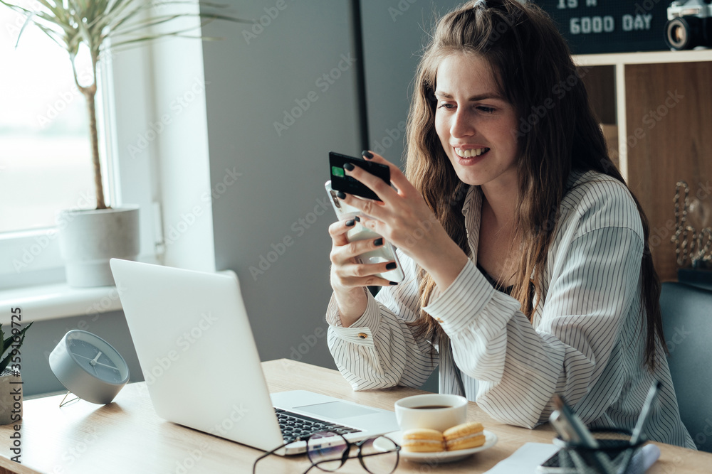Portrait of Young Adult Girl Working From Home and Doing Online Shopping with Credit Card, Freelance and Remote Work Concept Portrait of Young Adult Girl Working From Home and Doing Online Shopping with Credit Card, Freelance and Remote Work Concept