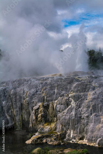 Active geysers erupting above sulphur covered rocks