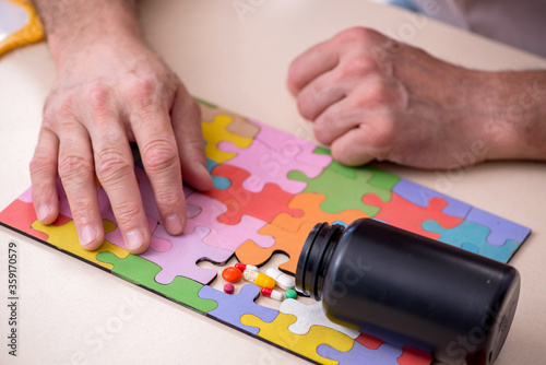 Doctor and patient suffering from Alzheimer disease