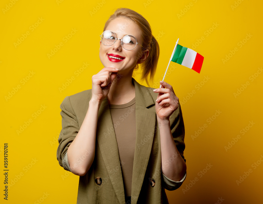 Naklejka premium Style blonde woman in jacket with Italian flag on yellow background