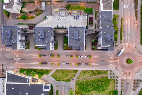 Aerial view to the modern apartment complex and street in summer evening, Espoo, Finland. Looking straight down with a satellite image style.