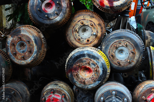 A pile of rusty old car parts at the old car spare parts market