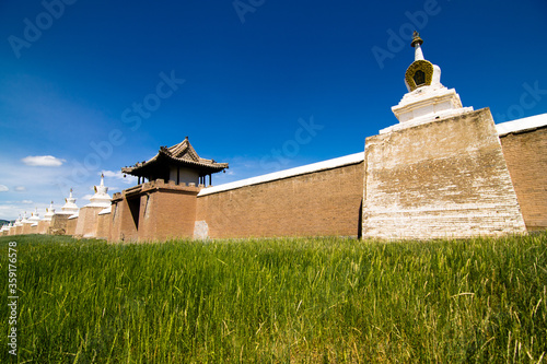 Walls of the historic city of Kharkhorin behind tall grass, Mongolia photo