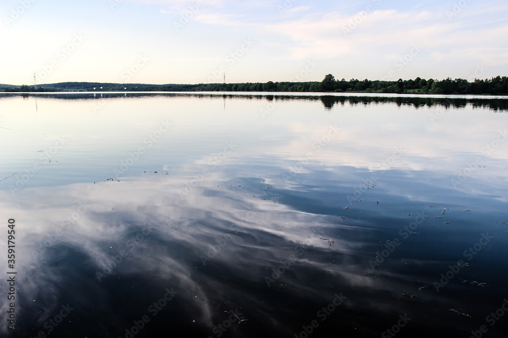 reflection of clouds in a blue lake reflection of clouds in a blue lake