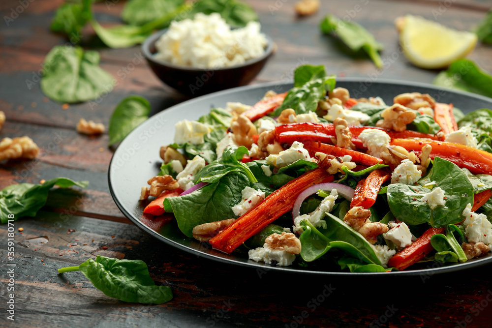 Roasted carrot salad with feta cheese, walnut and spinach. healthy food Roasted carrot salad with feta cheese, walnut and spinach. healthy food