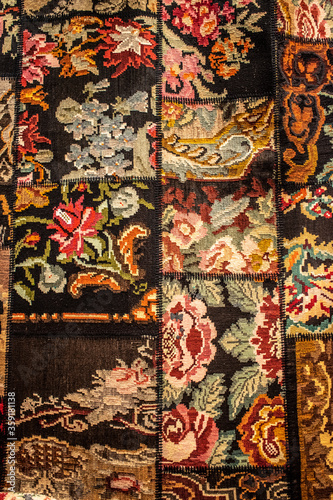 The handmade Turkish carpet is decorated with floral motifs.