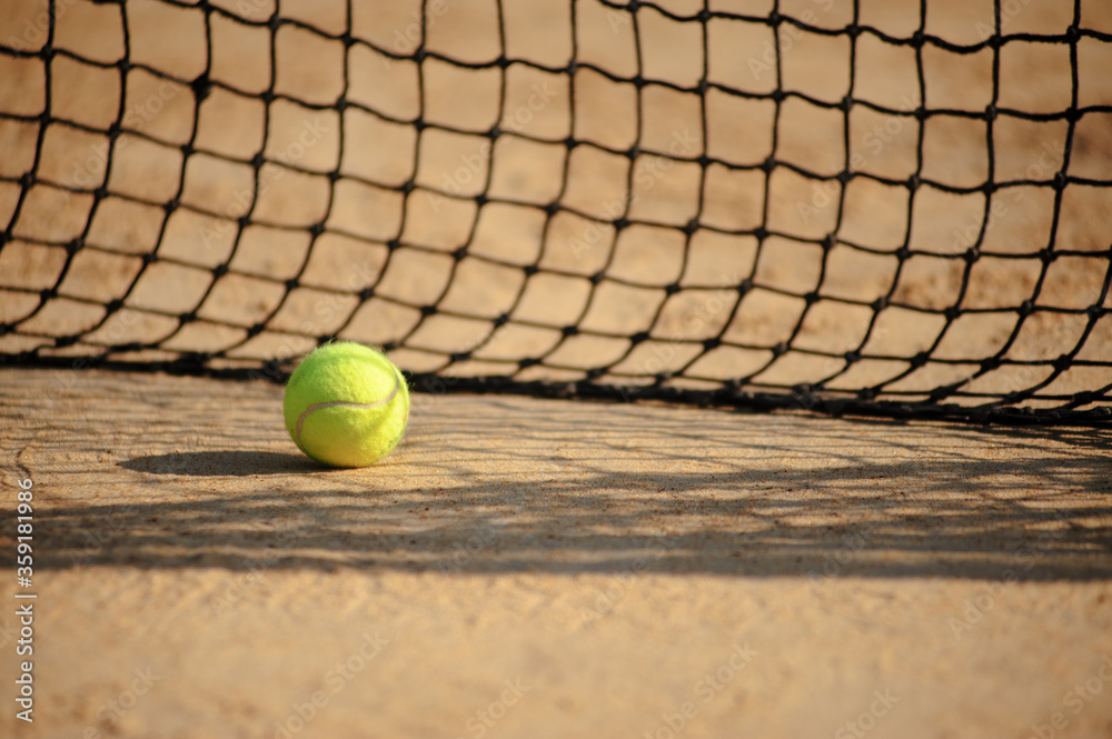 A tennis net and ball. Sport concept. Select focus
