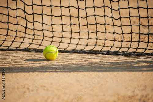A tennis net and ball. Sport concept. Select focus © vitleo