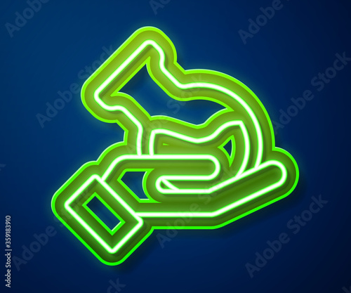 Glowing neon line Test tube and flask in hand icon isolated on blue background. Chemical laboratory test. Laboratory glassware. Vector.
