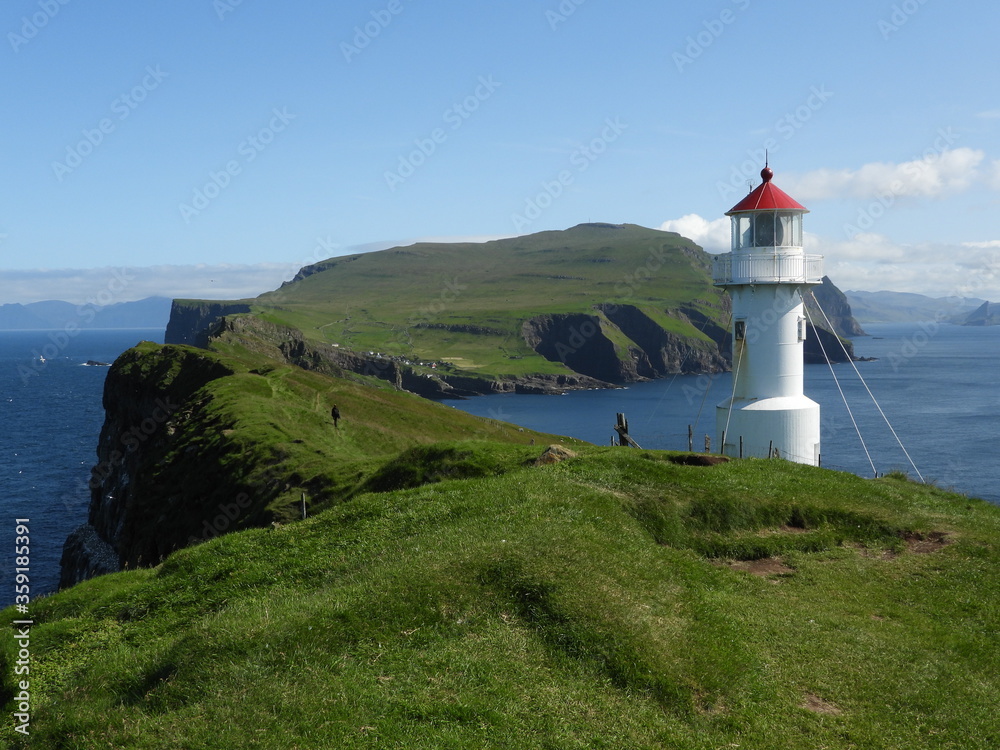Lighthouse on a small island of Mykines, Faroe islands