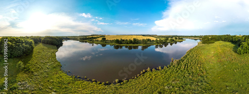 Sredny Khutor farm near the small Zelenchuk second river in the Krasnodar Territory, South of Russia. Aerial little panorama on a summer day