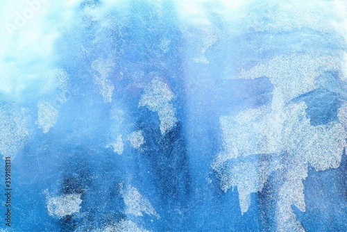 Frost pattern on the glass. Frost on the window. Winter photo. Cryesthesia. Freezing.