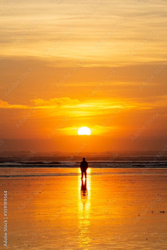 Silhouetted Man at Sunset on the Beach  - Saunton, Devon, England