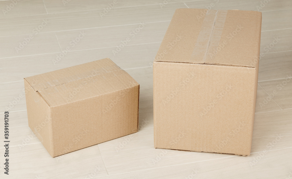 Blank paper cardboard box mockup on the floor, Packaging template. Blank paper cardboard box mockup on the floor, Packaging template.