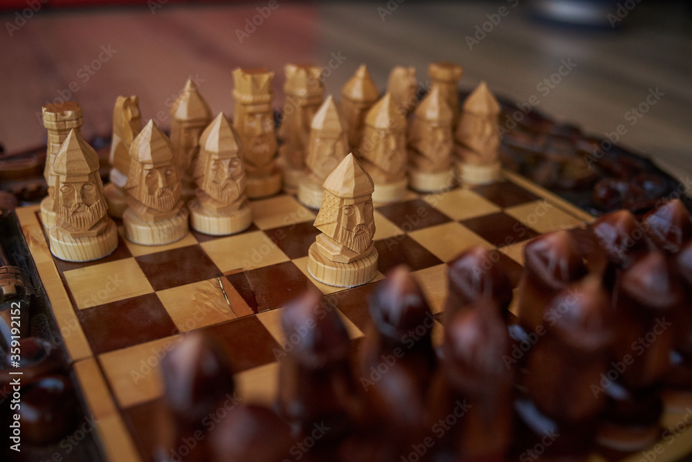 moving chess figure success play. Hand of player chess board game putting black pawn. wooden chess pieces. leader and success moving chess figure success play. Hand of player chess board game putting black pawn. wooden chess pieces. leader and success