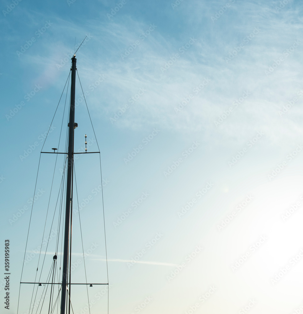 yacht mast, marine, sunsire yacht mast. sailing ship mast in front of blue sky yacht mast, marine, sunsire yacht mast. sailing ship mast in front of blue sky