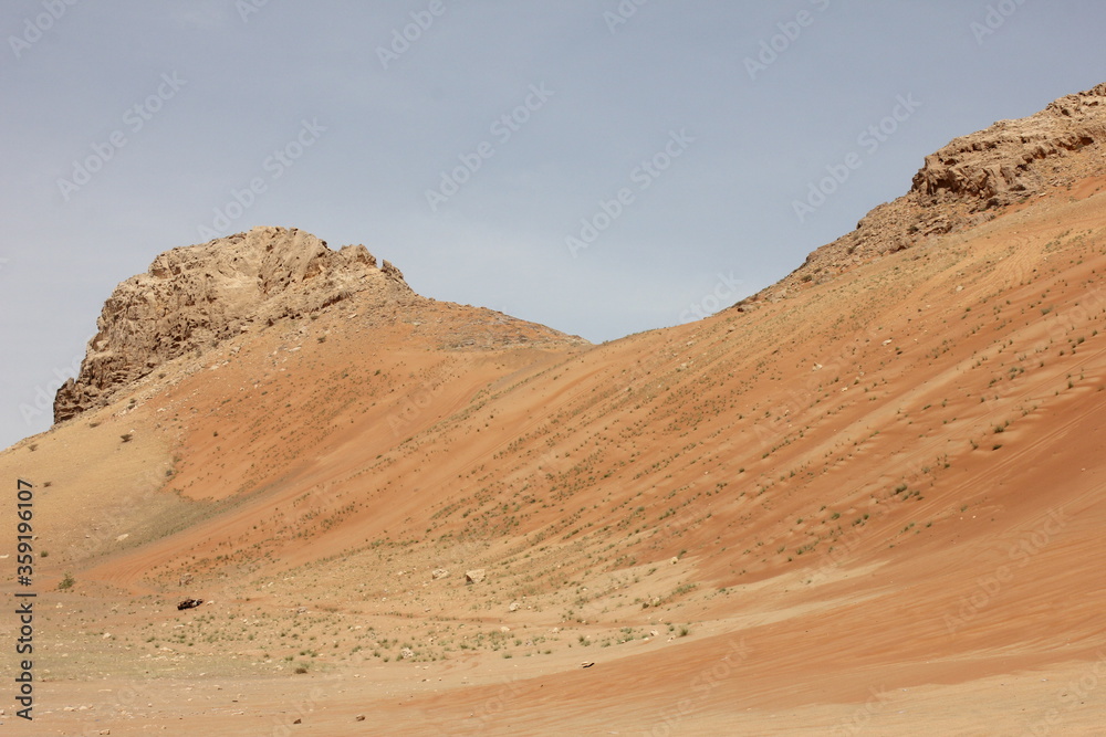 Hot and arid desert sand dunes terrain in Sharjah emirate in the United Arab Emirates. The oil-rich UAE receives less than 4 inches of rainfall a year and relies on water from desalination plants. Hot and arid desert sand dunes terrain in Sharjah emirate in the United Arab Emirates. The oil-rich UAE receives less than 4 inches of rainfall a year and relies on water from desalination plants.